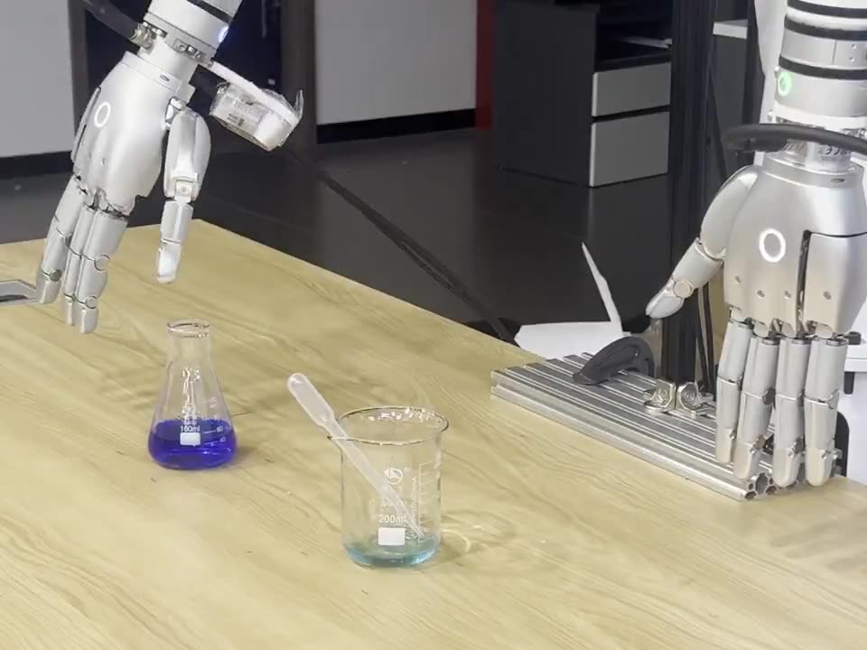 The hand withdrawing, the pipette left lying across the beaker rim